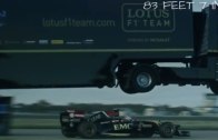 A truck jumps over a F1 racing car