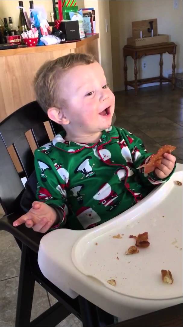 Baby tries bacon for the first time