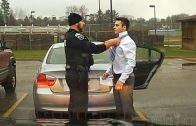 Police officer helps student tie his tie